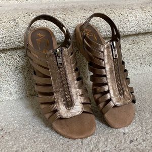 New, never worn gold colored shoes with zipper.